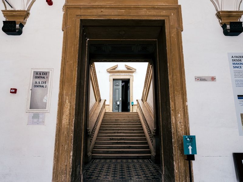 The monumental portal and staircase of the College of Jesus, the Mineralogy and Geology door beyond.