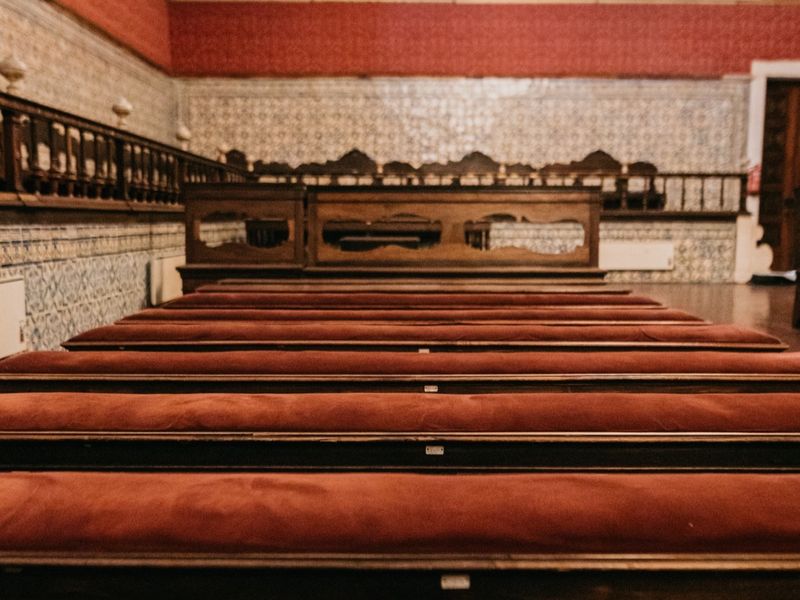 The red benches of the Sala dos Capelos, set out for a ceremony.