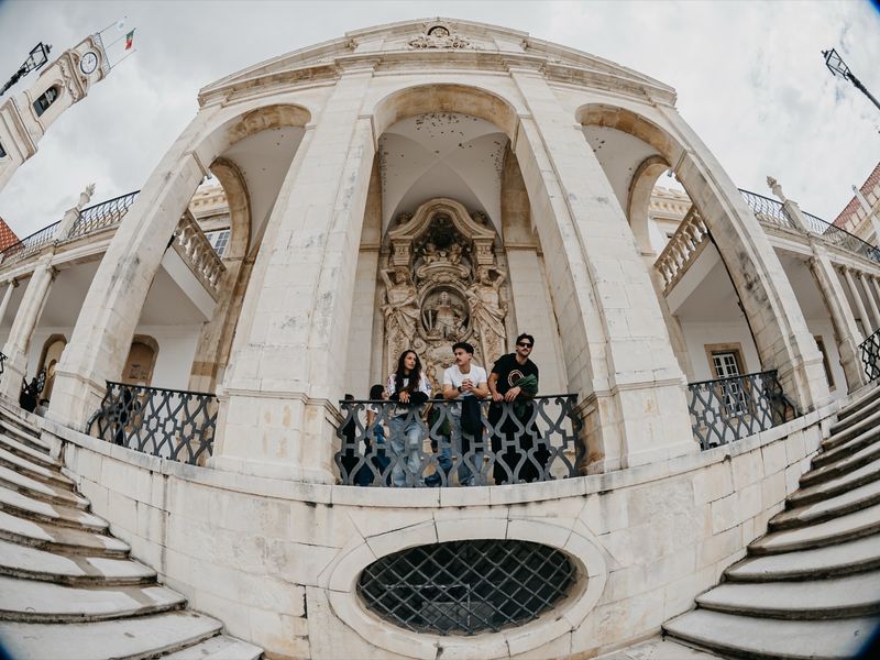Students gathered under the vaulted arcade of the Via Latina.