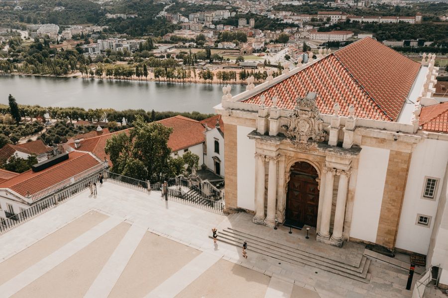 The Joanina Library seen from above, with the Mondego river and the city beyond.