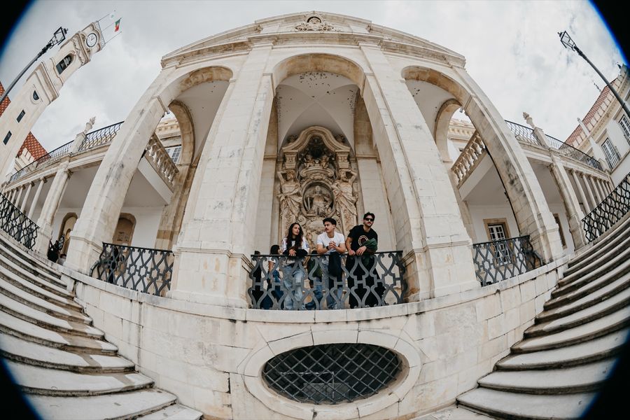Students gathered under the vaulted arcade of the Via Latina.